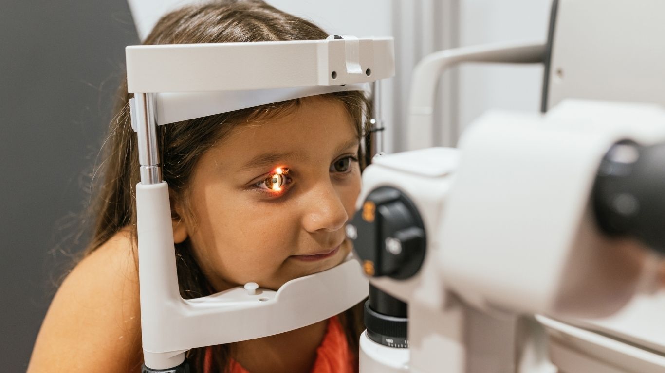 Little girl having her eyes scanned